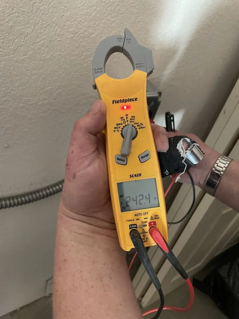 Voltage testing with clamp meter during Generator Installation in Summit Hill